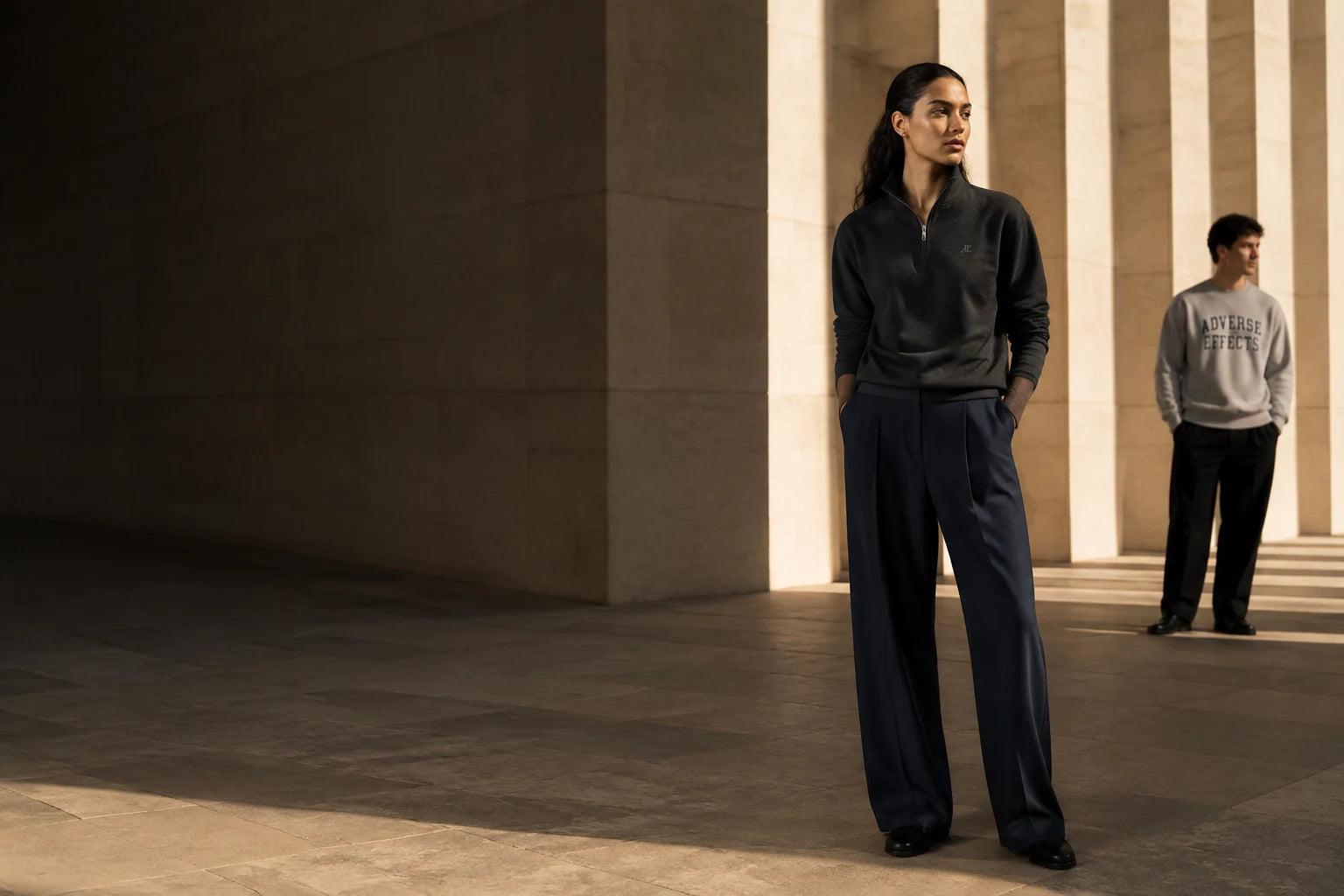 AE Collection in limestone architecture: a charcoal quarter zip and heather crew
